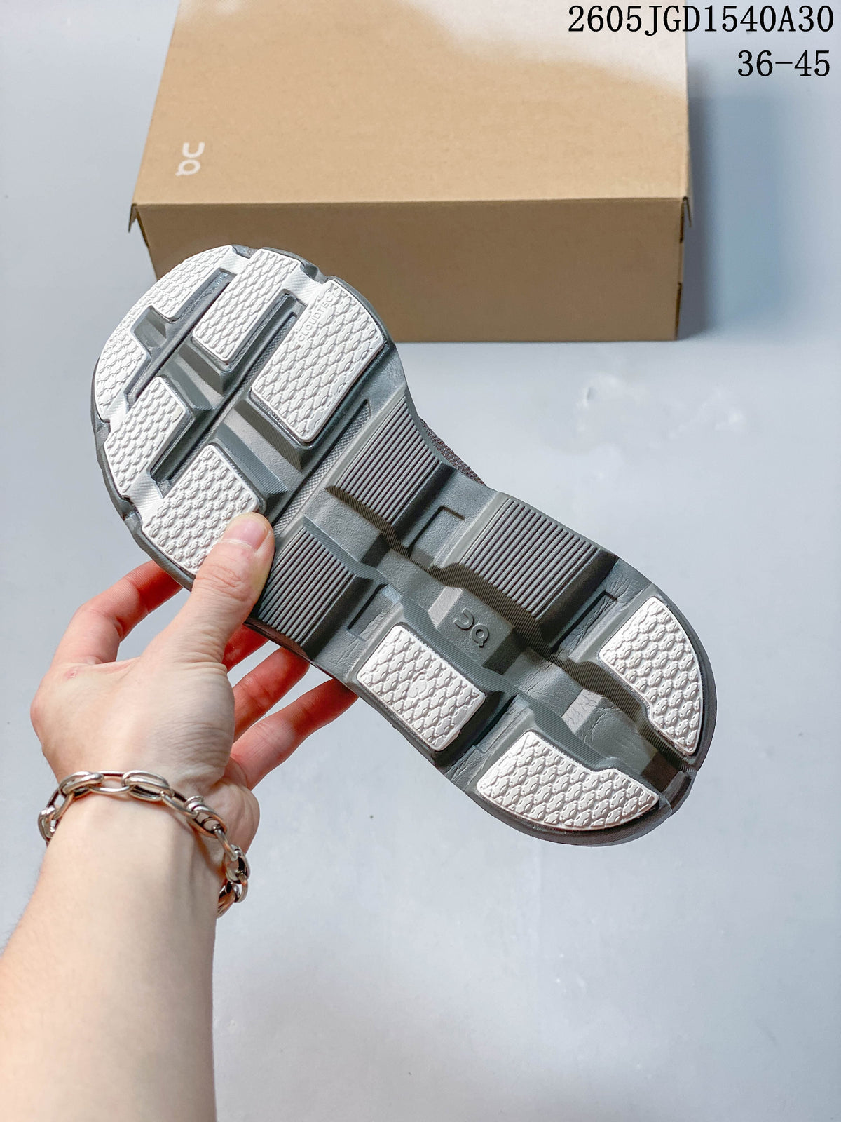 On Cloudmonster Void Low-Top Sneakers in Gray