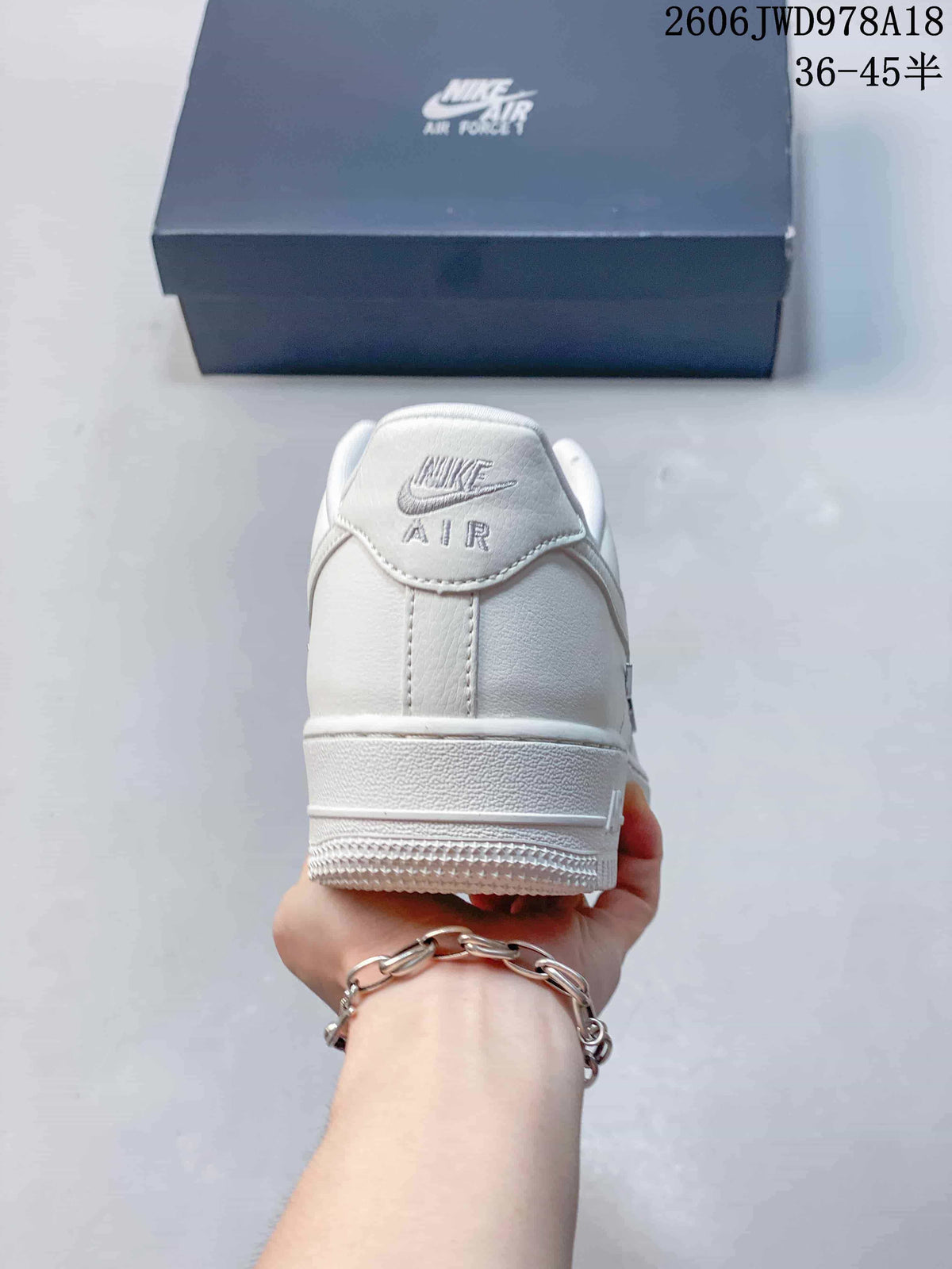 Nike Air Force 1 Low White Sneakers with Metallic Swoosh Details