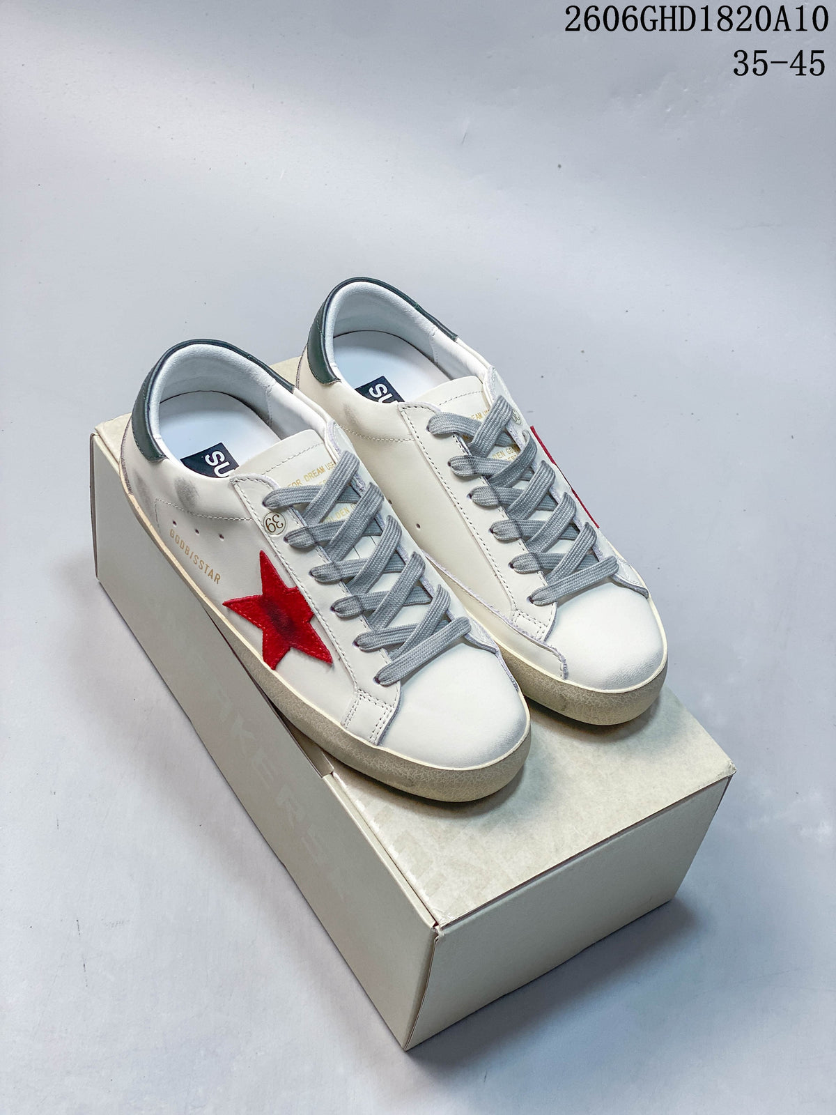 Golden Goose Super-Star Sneakers in White with Red Star