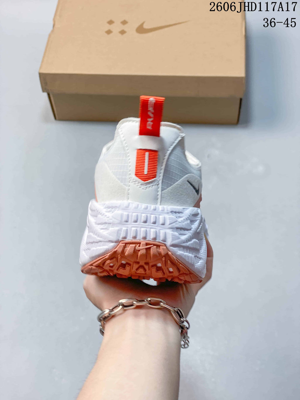 Nike Ava Rover Low-Top Sneakers in White and Coral