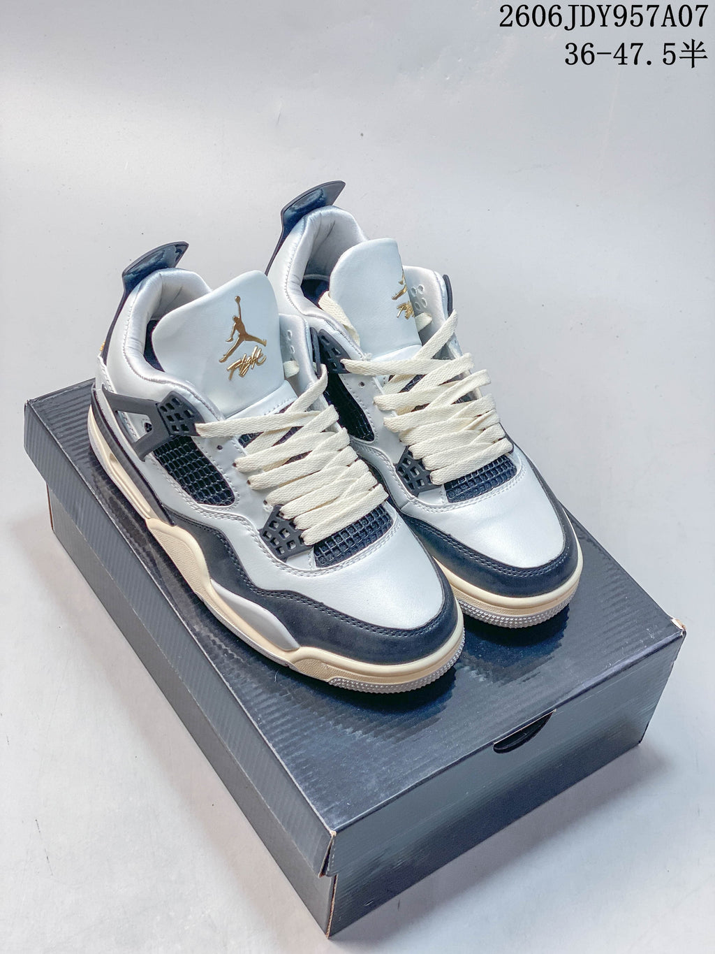 Jordan 4 Pure Platinum Mid-Top Sneakers in White and Black