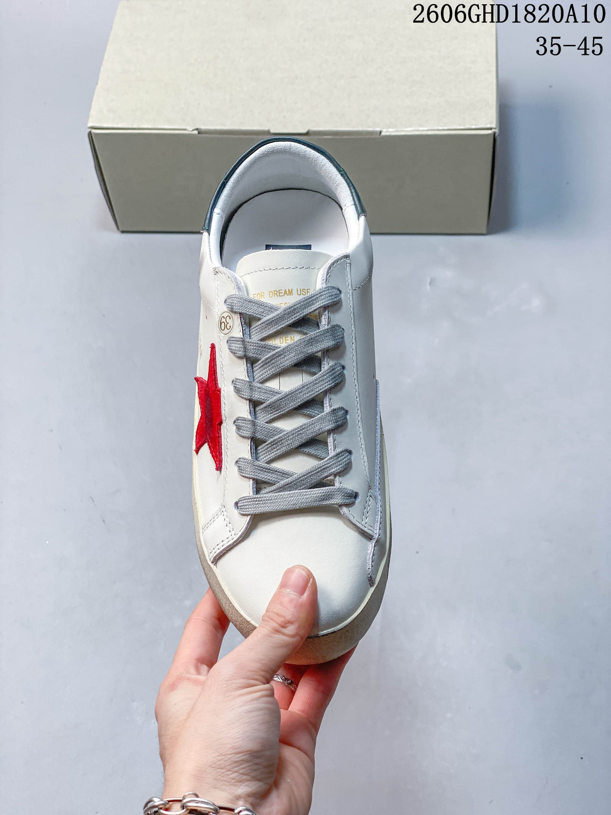 Golden Goose Super-Star Sneakers in White with Red Star