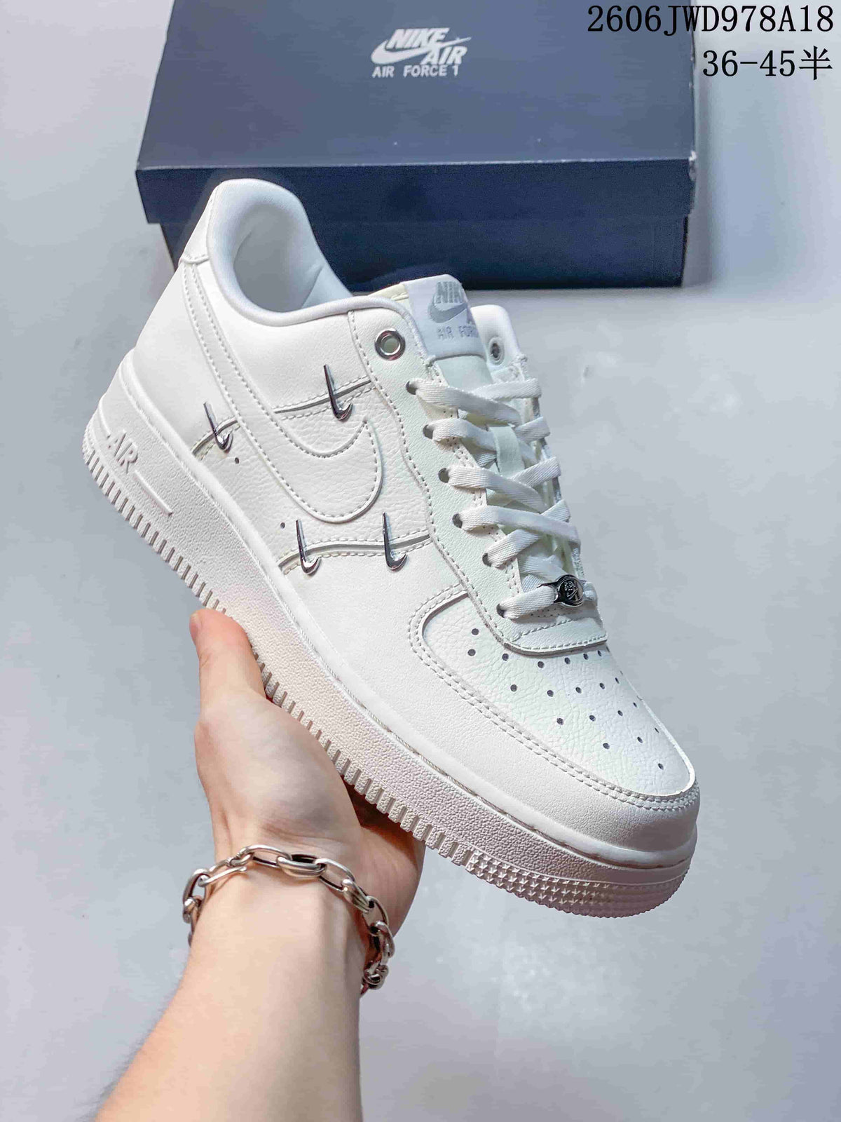 Nike Air Force 1 Low White Sneakers with Metallic Swoosh Details